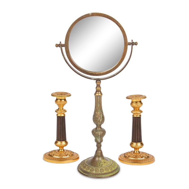 A Pair of Gilt Metal Mounted Candlesticks: A Pair of Gilt Metal Mounted Candlesticks together with a dressing mirror; 3 items total. Height of mirror 16 1/2 inches. Property from an Alessandra Branca-Designed Chicago Residence This lot is