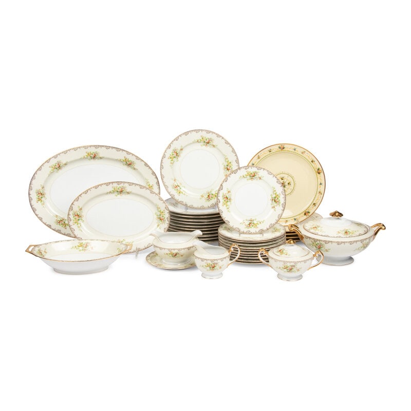 A Mieto Porcelain Dinner Service: A Mieto Porcelain Dinner Service comprising: 15 dinner plates 11 salad plates 1 creamer 1 covered sugar 1 footed sauce boat 1 tureen 3 serving platters 33 items total. Diameter of dinner plate 9 3/4