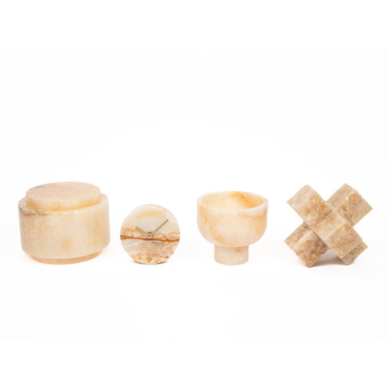 A Group of Onyx Table Articles: A Group of Onyx Table Articles comprising a table clock, a footed bowl, a round box, and a sculpture; 4 items total. Height of tallest 6 1/4 inches. Property from an Alessandra Branca-Designed