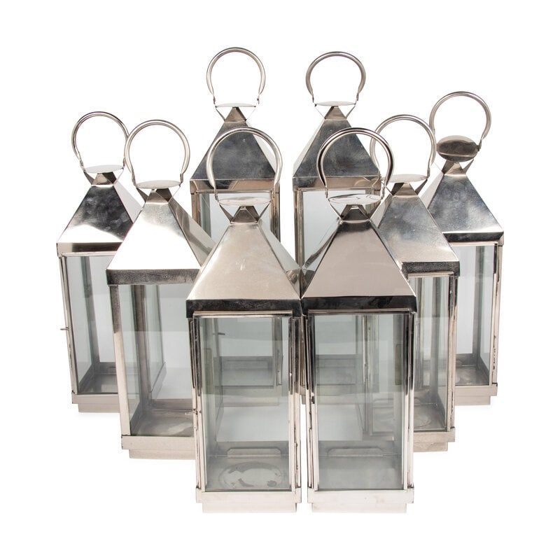 A Set of Eight Polished Nickel Lanterns: A Set of Eight Polished Nickel Lanterns 20th Century comprising a large pair of lanterns and a set of six smaller examples. Height of taller 25 inches Property from an Alessandra Branca-Designed