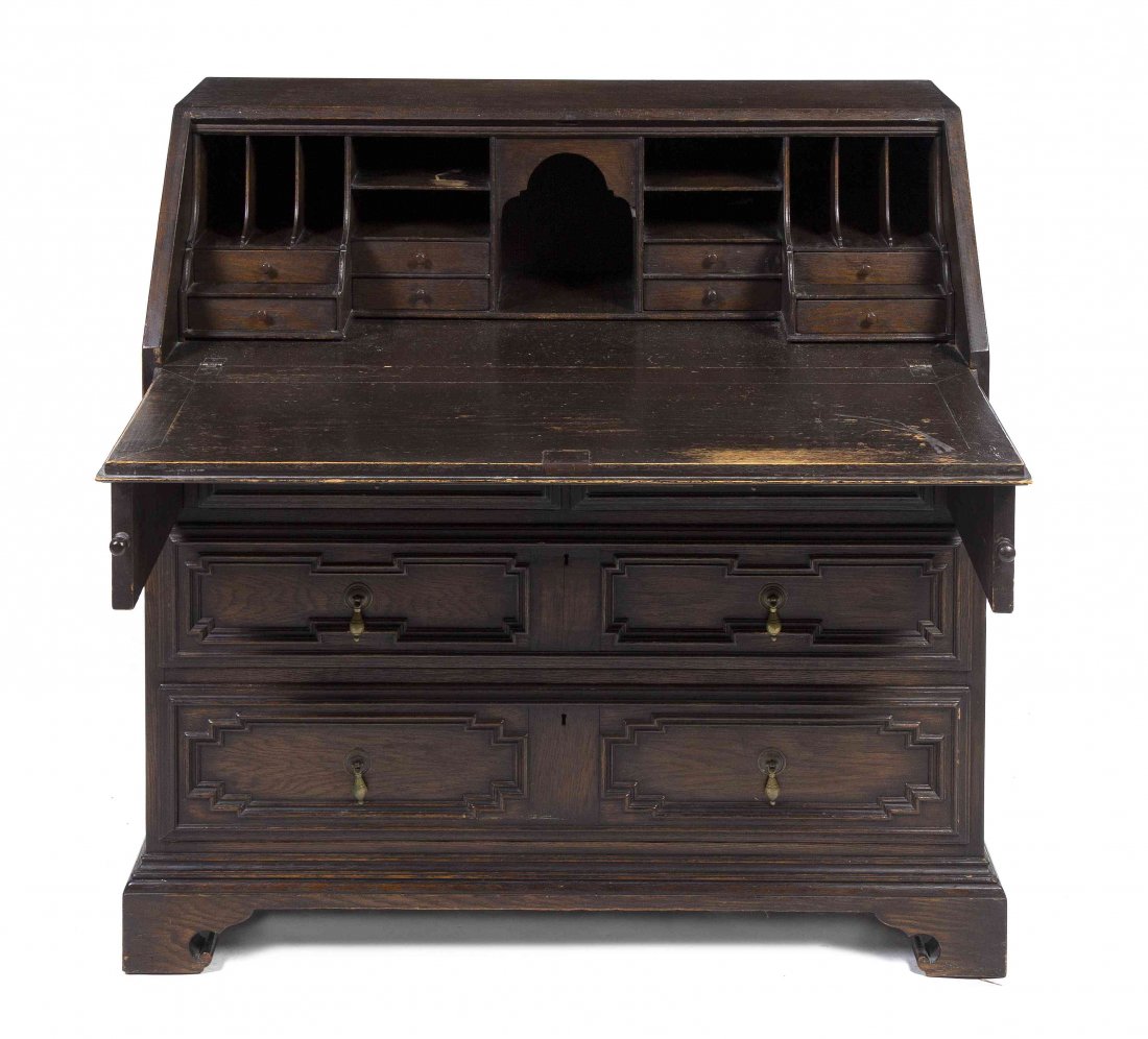 A Charles II Style Slant Front Writing Bureau, Height 4: A Charles II Style Slant Front Writing Bureau, the paneled fall front writing surface opening to a fitted interior above two short and two long drawers, raised on bracket feet. Height 42 x width 42 x 