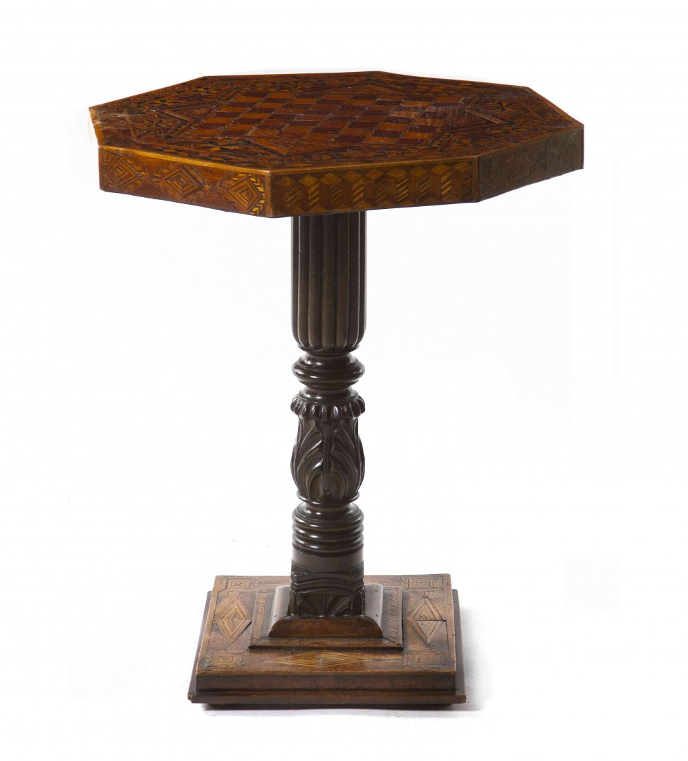 A Various Woods Inlaid Games Table, Height 28 1/2 x wid: A Various Woods Inlaid Games Table, having an octagonal top centered with a chessboard set on a carved wood standard and square base. Height 28 1/2 x width 22 x depth 22 inches.