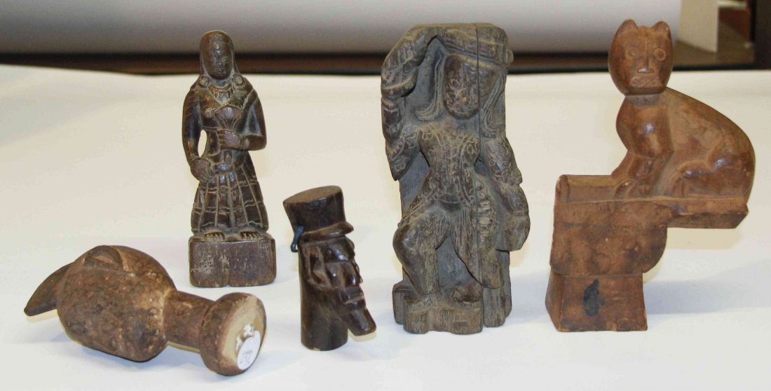 A Collection of Five Carved Wood Decorative Articles, H: A Collection of Five Carved Wood Decorative Articles, of various cultures, comprising two from Nepal and one from Guatemala. Height of tallest 8 inches. Property from the Estate of Mr. Emanuel Feingol