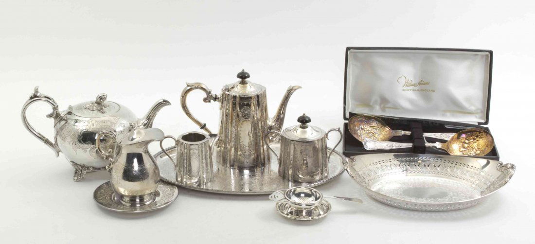 A Collection of English Silverplate Table Articles, Hei: A Collection of English Silverplate Table Articles, comprising a tea service with chased foliate decoration, including a teapot, a creamer, a covered sugar and tray, an associated teapot, a milk pitch