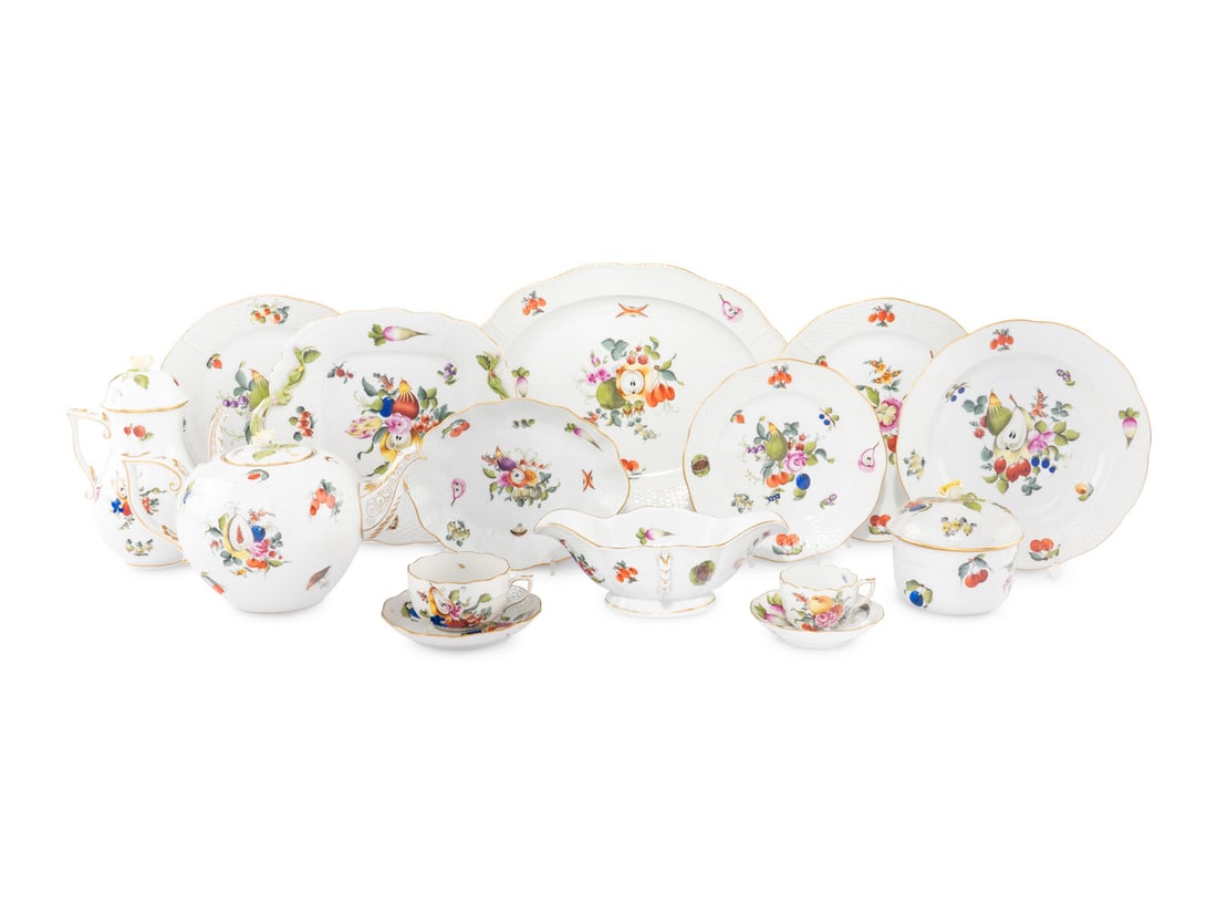 A Herend Fruits and Flowers Porcelain Dinner Service: A Herend Fruits and Flowers Porcelain Dinner Service 20th Century comprising: 23 dinner plates 12 salad plates 11 soup plates 12 teacups and saucers 13 coffee cups and saucers 1 triangular serving bow