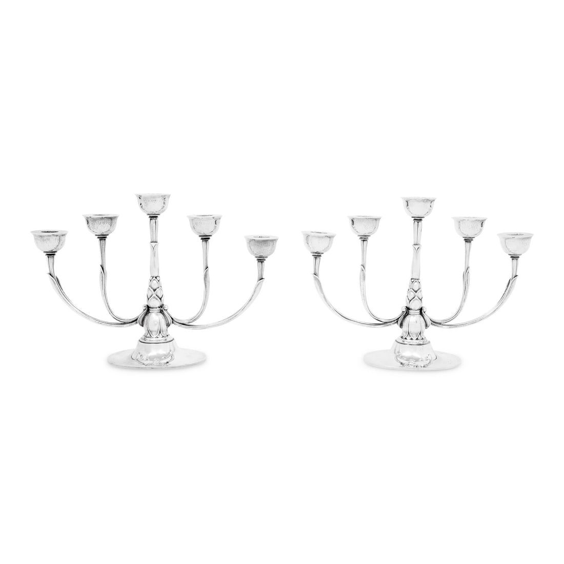 A Pair of Georg Jensen Silver Five-Light Candelabra: A Pair of Georg Jensen Silver Five-Light Candelabra Designed by Harald Nielsen, Circa 1938 model 537 A; each with an engraved presentation inscription underfoot. marked 'Sterling' to underside 65 ozt