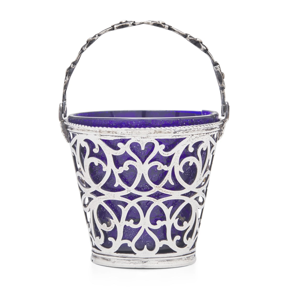 A George III Pierced Silver Cream Pail: A George III Pierced Silver Cream Pail Richard Mills, London, 1766 fitted with a cobalt glass liner, marked. 2 ozt (silver only) Height 4 x diameter 2 1/2 inches (with handle raised). Property from th