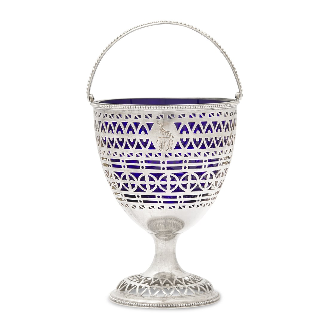 A George III Engraved and Pierced Silver Sugar Basket: A George III Engraved and Pierced Silver Sugar Basket Hester Bateman, London, 1783 engraved with dove holding an olive branch above the initials WB, fitted with a cobalt glass liner. hallmarked for St