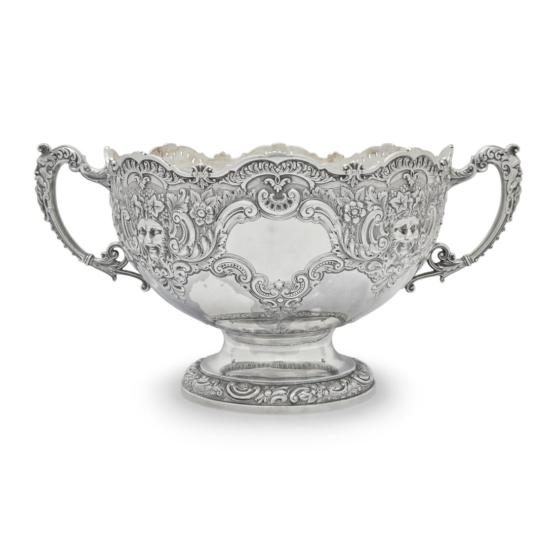 A Victorian Silver Rose Bowl: A Victorian Silver Rose Bowl Samuel Fenton and William Staniforth, Sheffield, 1894 retailed by Birks, Canada; with pierced rim, the scrolled handles cast with bearded masques, the body decorated with