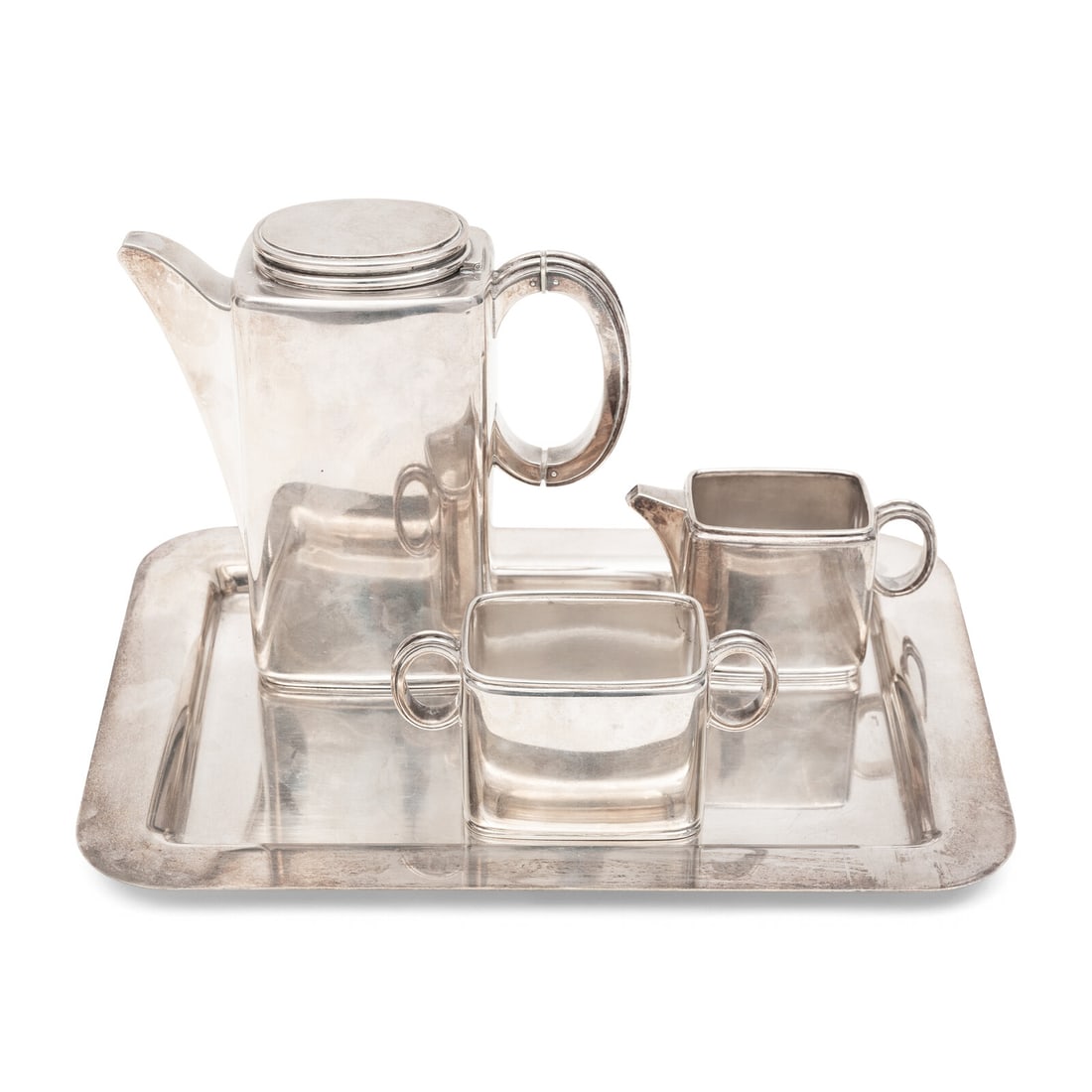 A Danish Silver Three-Piece Coffee Service: A Danish Silver Three-Piece Coffee Service Roif Fritiof Bratland, Copenhagen, 1946 comprising a coffee pot, creamer and sugar bowl each stamped [FB] Bratland Sterling Denmark, the creamer further stam