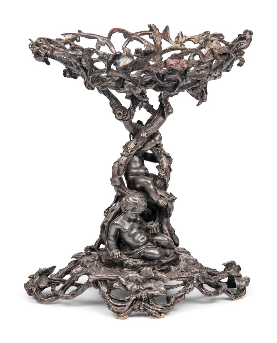 A Napoleon III Electroplated Bronze Centerpiece: A Napoleon III Electroplated Bronze Centerpiece Christofle et Cie, Paris, 19th Century interior of basket stamped 'Christofle' with company mark, the base stamped several times with 'E' and '555850' t