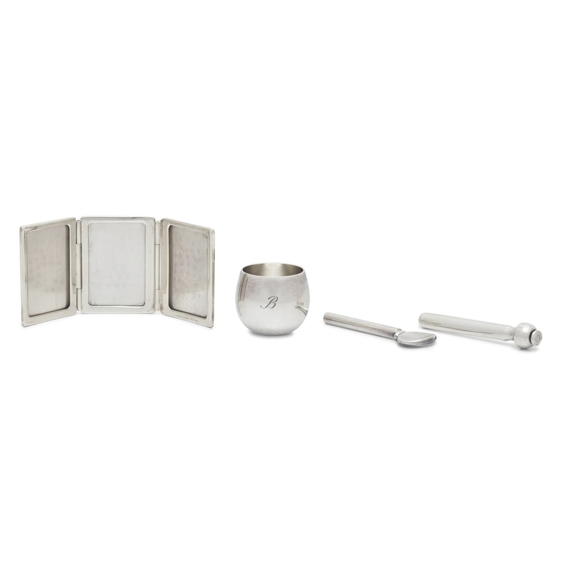 A Group of Tiffany and Co. Silver Articles: A Group of Tiffany and Co. Silver Articles 20th Century comprising a tri-fold picture frame, a medicine cup, engraved with monogram, "B", and a feather-form pen; all marked, the frame also marked "Mex