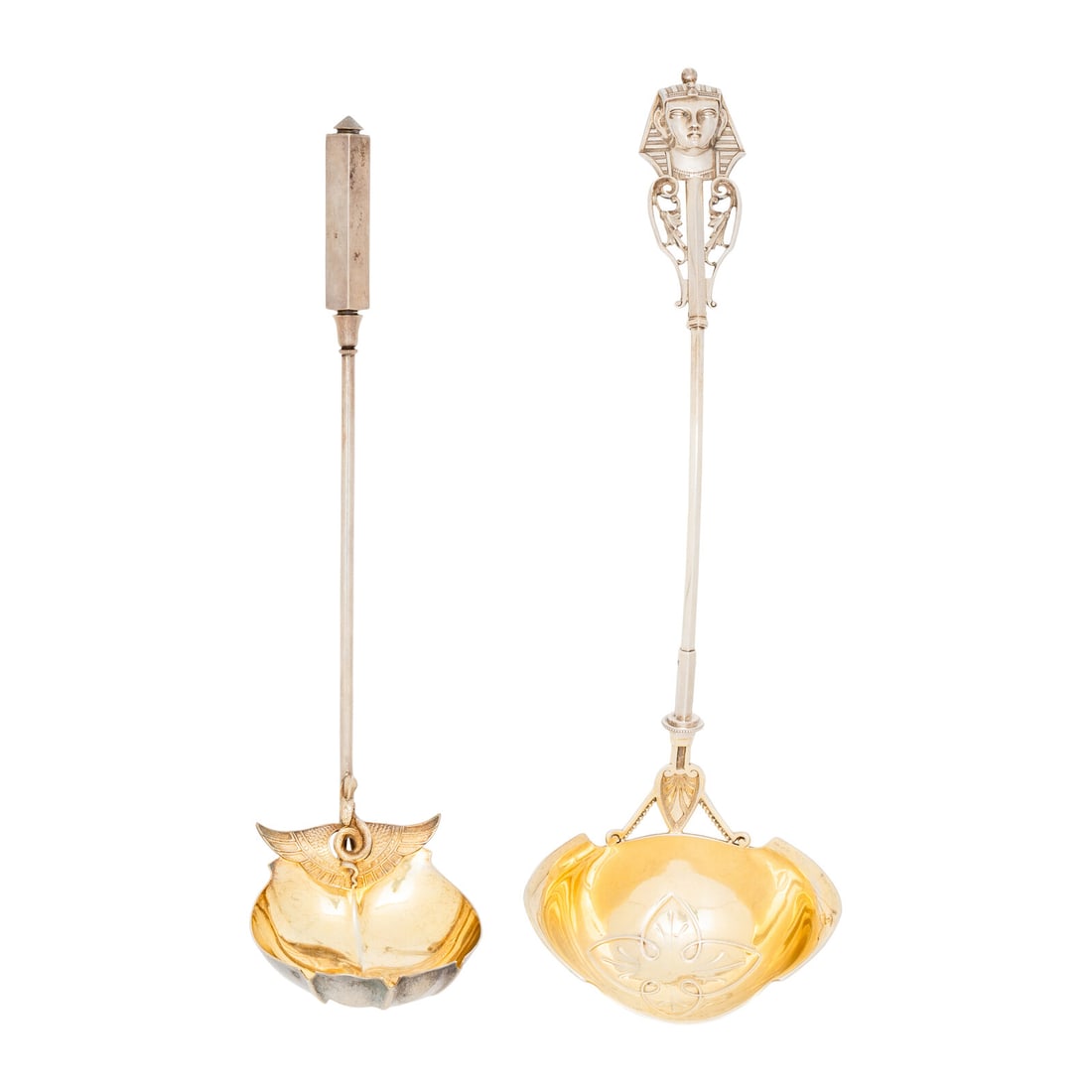 Two American Silver Egyptian Style Ladles: Two American Silver Egyptian Style Ladles Circa 1870 the first with pharaoh's head terminal above openwork brackets, bowl chased with palmettes, by Wood & Hughes; marked '900/1000'; the second wit
