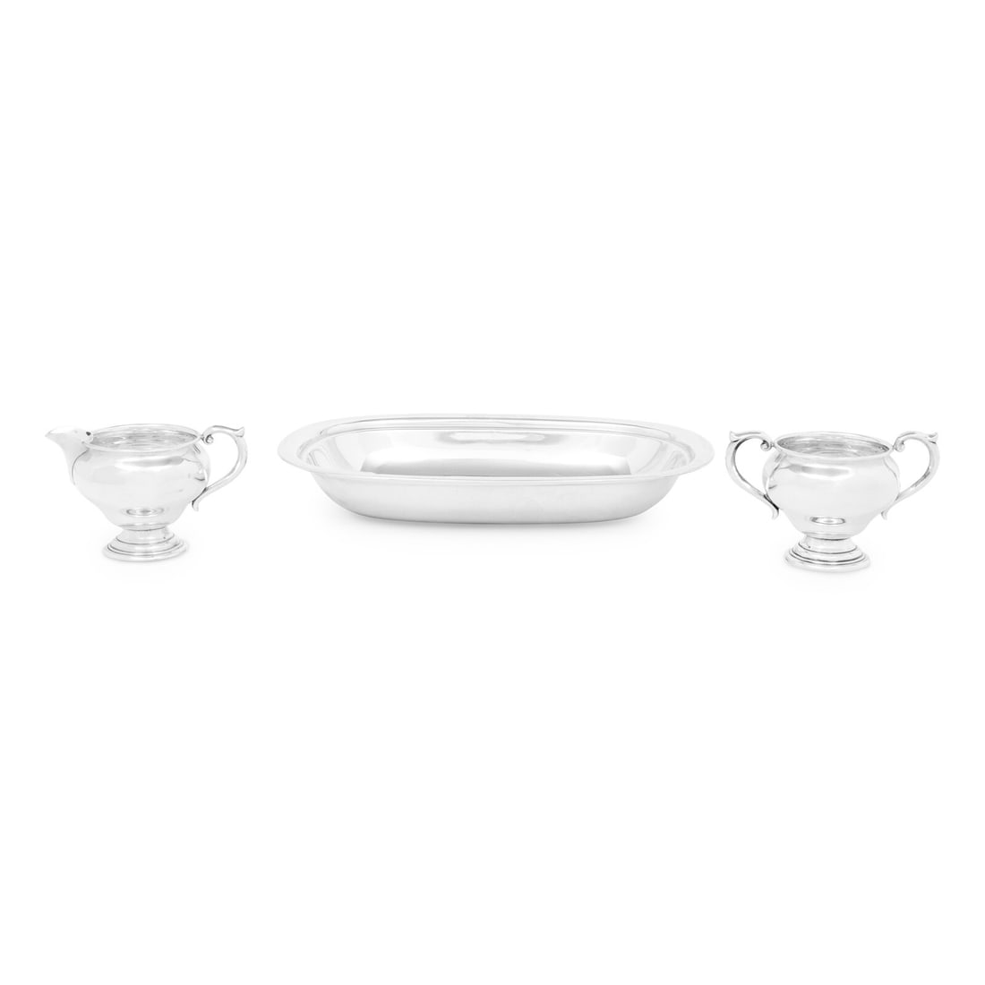 A Group of Three American Silver Table Articles: A Group of Three American Silver Table Articles 20th Century comprising a creamer and sugar set marked for Newport Silver Co, and a serving bowl marked for Reed and Barton. each marked 'Sterling' on u