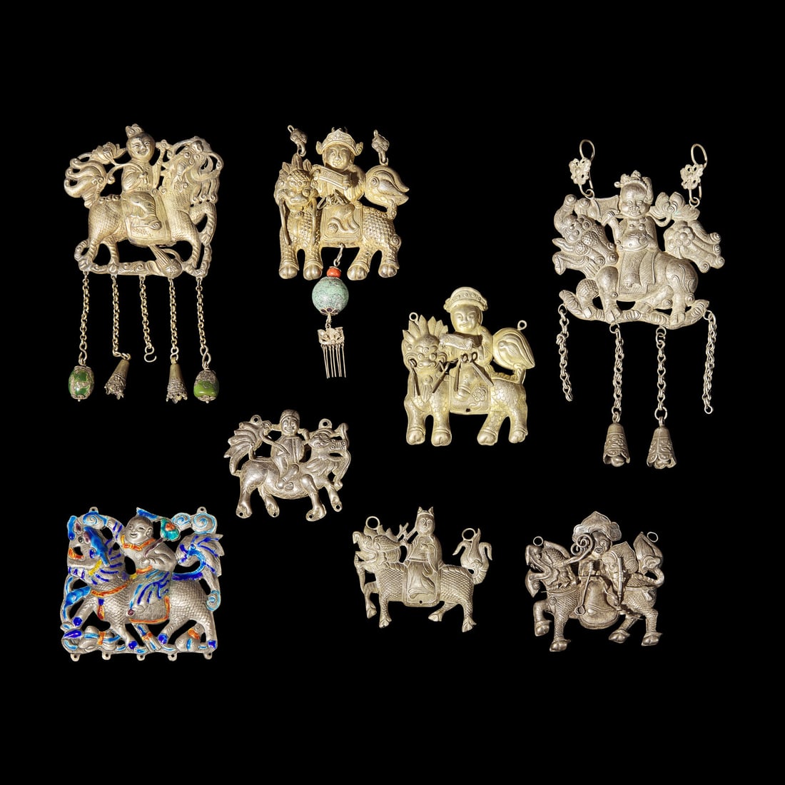 Eight Chinese Silver 'Boy and Qilin' Pendants, Late Qing Dynasty-Republic Period 晚清: Eight Chinese Silver 'Boy and Qilin' Pendants, Late Qing Dynasty-Republic Period 晚清-民國 銀鍍金、銀燒藍及銀製ƕ