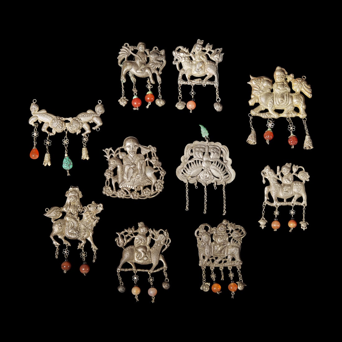 A Group of 10 Assorted Chinese Silver 'Boy and Qilin' Pendants, Late Qing Dynasty-Republic Period (1 of 7)