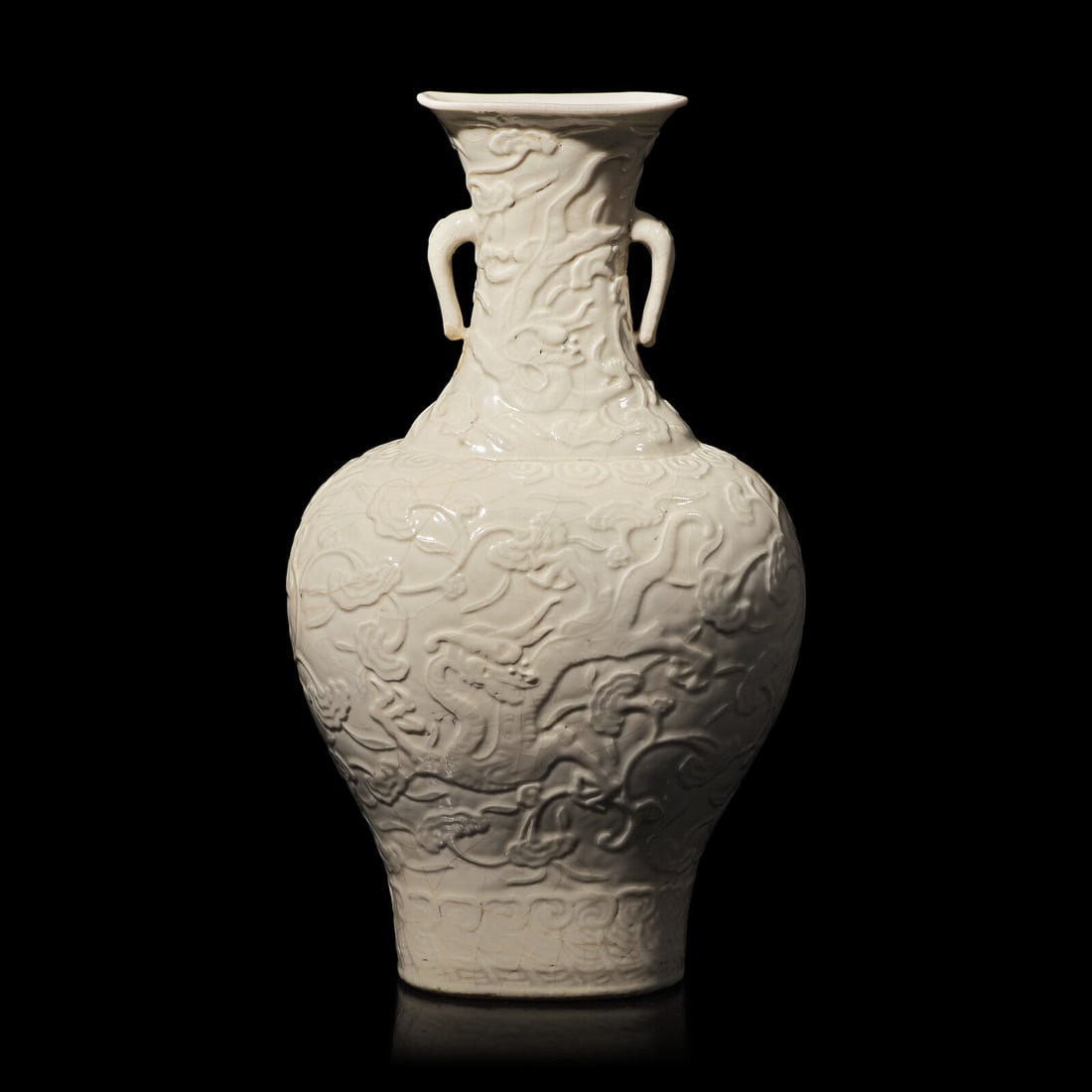 A Chinese White Glazed Soft Paste Molded 'Dragons and Lingzhi' Vase, 18th Century 清中 (1 of 6)