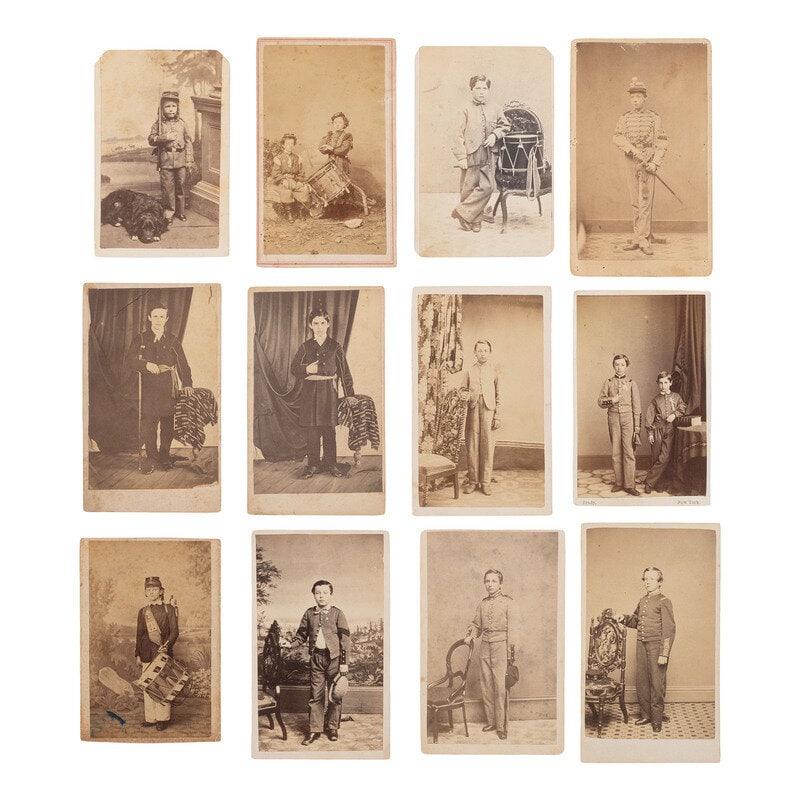 [Civil War] Group of 12 Carte de Visites of Children in Civil War Uniforms : [Civil War] Group of 12 Carte de Visites of Children in Civil War Uniforms 12 CDVs on cardstock mounts, each showing young male subjects in Civil War or militia-style uniforms, some posed with weapon