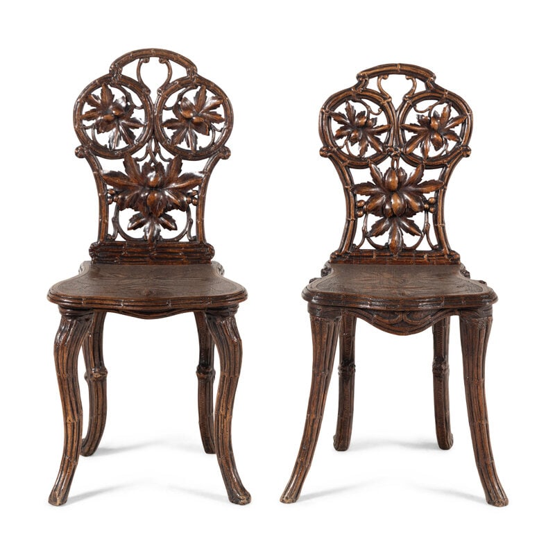 A Pair of Black Forest Oak Leaf Carved Side Chairs: A Pair of Black Forest Oak Leaf Carved Side Chairs 19th Century Height 34 x width 15 1/2 x depth 17 1/2 inches. From an Old Hollywood Family This lot is located in Chicago. 