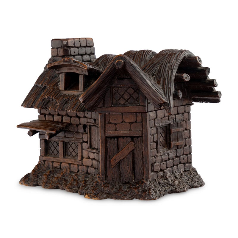 A Black Forest Carved Jewelry Box: A Black Forest Carved Jewelry Box 19th Century in the form of a brick and wood cabin with a thatched roof. The interior features tufted silk. Key included. Height 6 1/4 x width 8 1/2 x depth 5 1/2