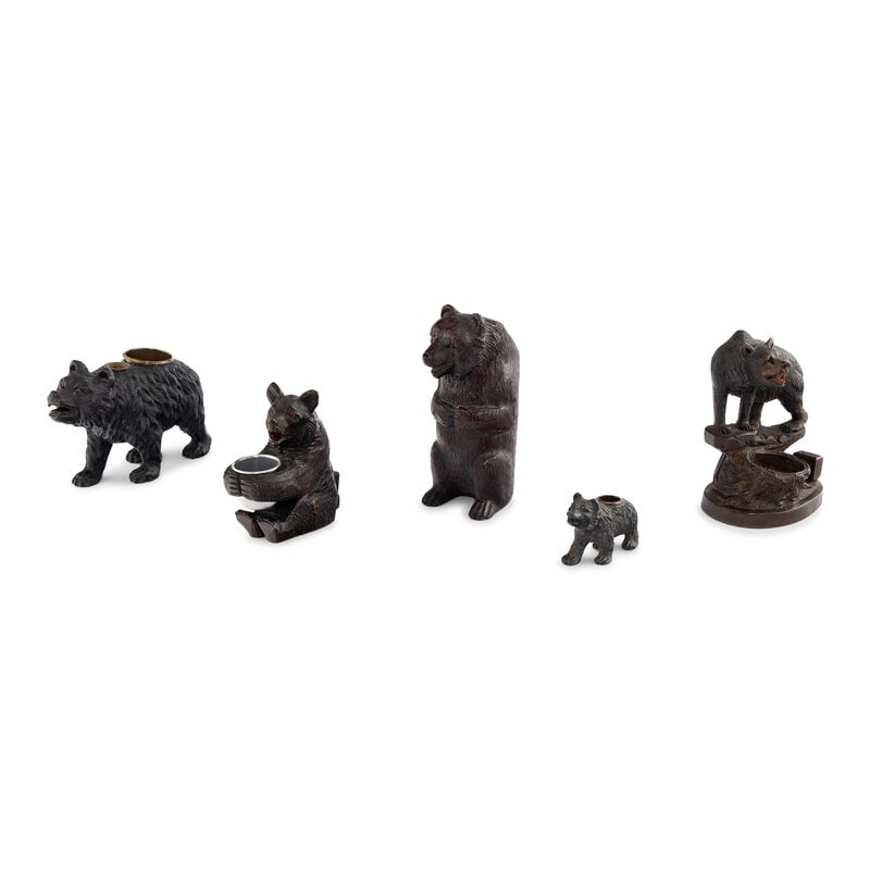 Five Black Forest Bear Table Objects: Five Black Forest Bear Table Objects 19th Century includes two carved wooden match holders, two cast metal candlesticks and a resin vessel. Largest height 9 1/4 inches. From an Old Hollywood Family