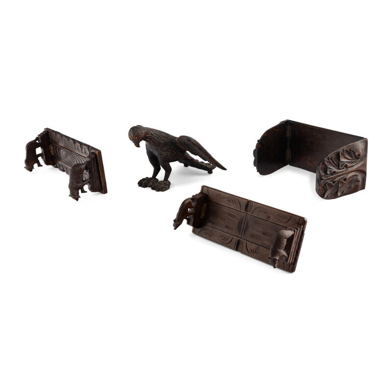 A Group of Four Black Forest Carved Book Racks and Stands: A Group of Four Black Forest Carved Book Racks and Stands 19th Century includes a carved eagle book stand, two bear form carved book racks and a floral carved book rack. Largest height 8 1/2 x length