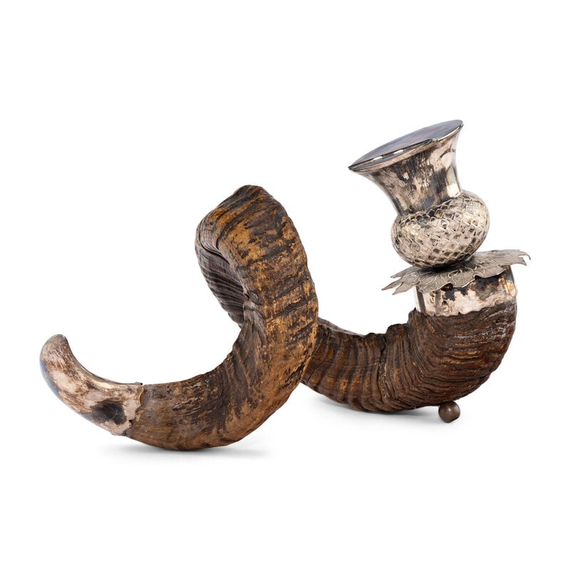 A Ram's Horn Snuff Caddy with Silverplate Mounts: A Ram's Horn Snuff Caddy with Silverplate Mounts Scottish, 19th Century with a thistle form well. Height 8 x length 14 inches. From an Old Hollywood Family This lot is located in Chicago. 