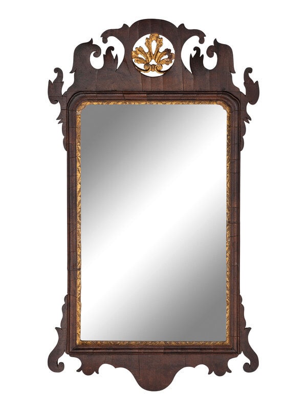 A Chippendale Carved and Parcel-Gilt Figured Mahogany Looking Glass: A Chippendale Carved and Parcel-Gilt Figured Mahogany Looking Glass Circa 1780 30 3/8 x 17 1/4 inches. This lot is located in Cincinnati. 