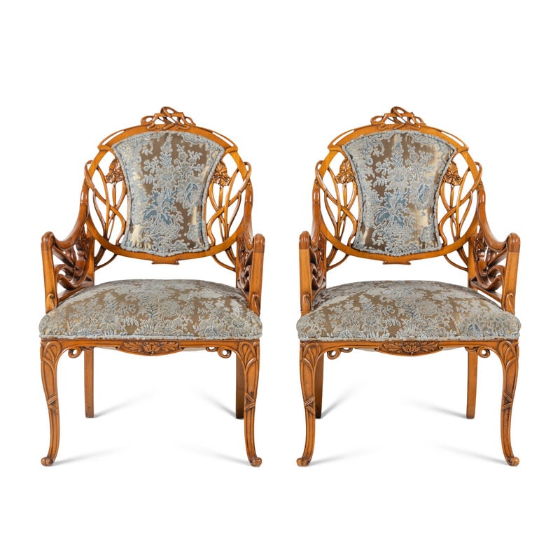 A Pair of Art Nouveau Style Carved Fruitwood Armchairs: A Pair of Art Nouveau Style Carved Fruitwood Armchairs Mid-Late 20th Century Height 38 x width 24 1/2 x depth 24 inches. Property of a California Collector This lot is located in Chicago.