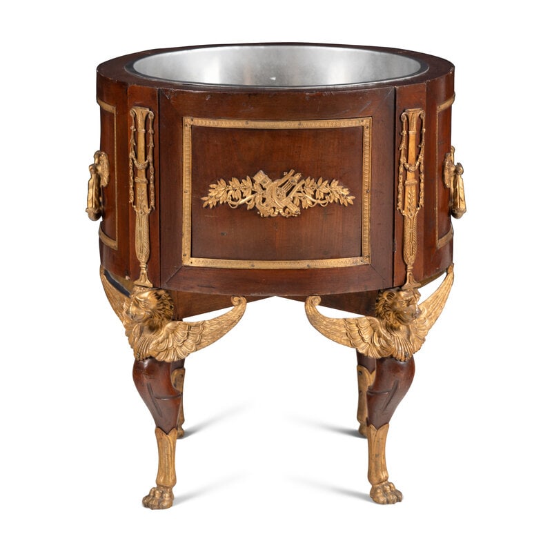 An Empire Style Gilt-Bronze Mounted Mahogany Jardinière : An Empire Style Gilt-Bronze Mounted Mahogany Jardinière 20th CenturyHeight 26 x diameter 22 1/4 inches. Property of a California Collector This lot is located in Chicago. SizeHeight 26 x
