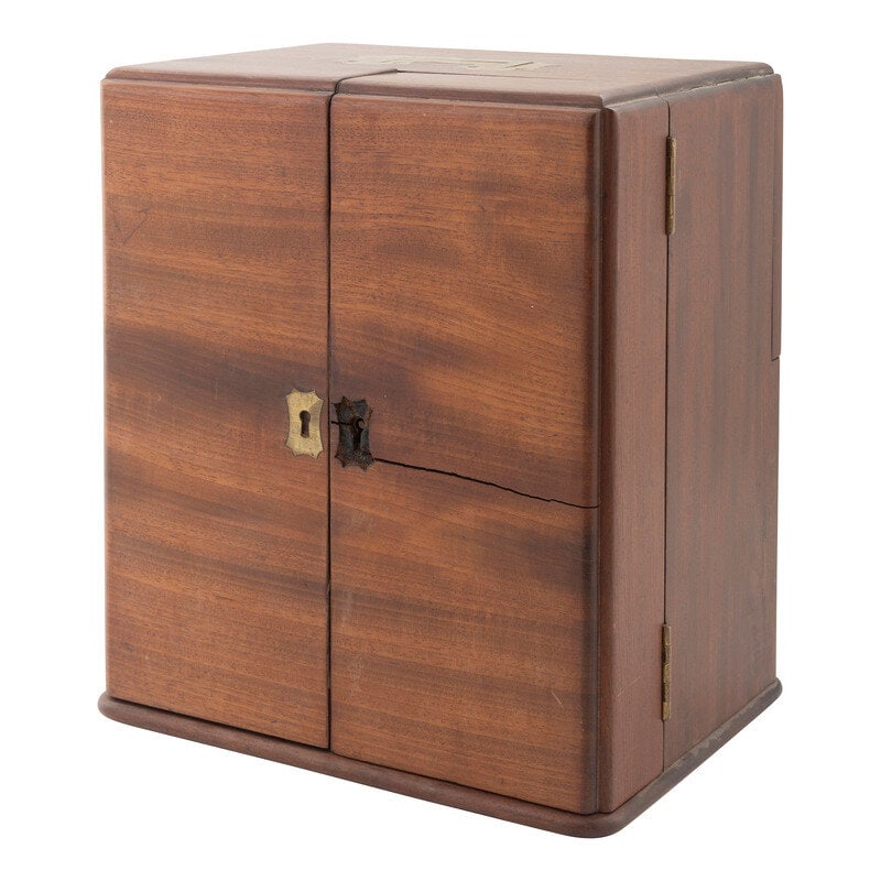 [Medicine] 19th Century wooden cased apothecary cabinet. : [Medicine] 19th Century wooden cased apothecary cabinet. wooden cabinet with two doors to front, the interior fitted with compartments with bottles and two small drawers containing additional bottles