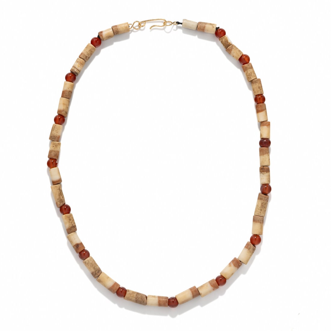 A Western Asiatic Carnelian and Tubular Bead Necklace: A Western Asiatic Carnelian and Tubular Bead Necklace Circa Late 3rd-Early 2nd Millennium B.C. Length 44.5 cm (17 1/2 inches). Property from a Private Brooklyn Collection Provenance: Kay Serhal