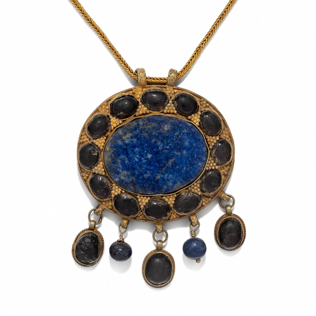 A Western Asiatic Gold and Lapis Lazuli Necklace: A Western Asiatic Gold and Lapis Lazuli Necklace Circa 3rd-2nd Century B.C. Height of pendant 8 cm (3 1/8 inches); 18 karat gold; 78.5 grams. Provenance: Mehdi Mahboubian (1921-2005), New York