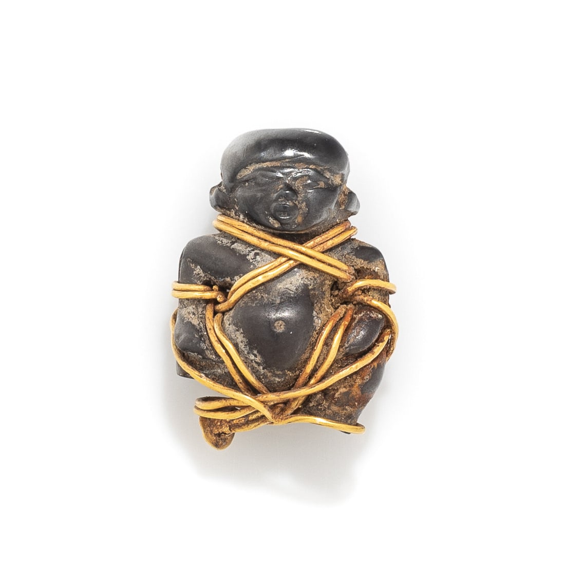 An Egypto-Phoenician Hematite Double-Sided Pataikos: An Egypto-Phoenician Hematite Double-Sided Pataikos Bound in gold wire Circa 7th-6th Century B.C. Height 1.9 cm (3/4 inch); High karat gold; 5.11 grams. Provenance: Fortuna Fine Arts, New York,