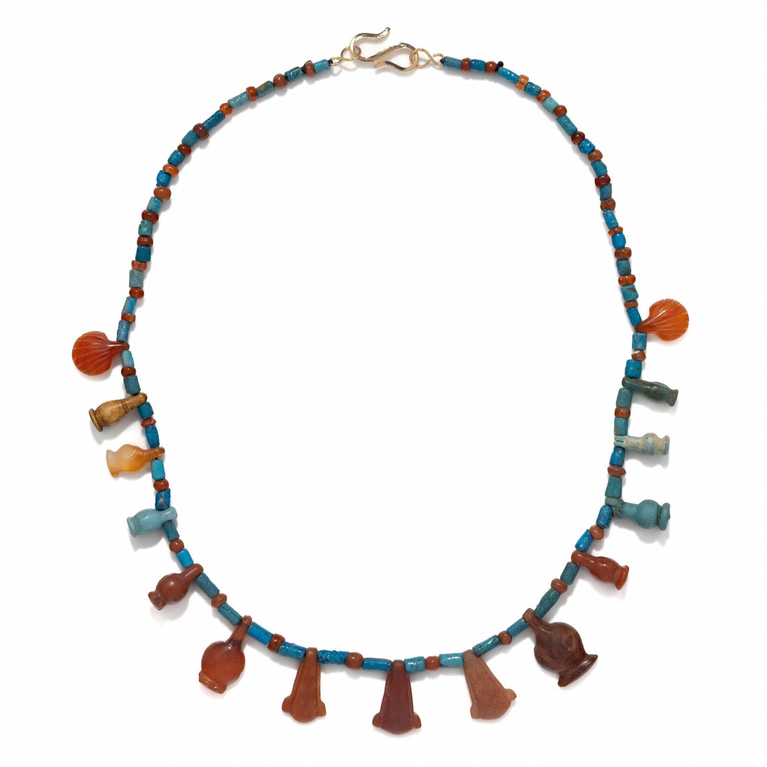 An Egyptian Carnelian and Faience Bead Necklace: An Egyptian Carnelian and Faience Bead Necklace New Kingdom, 18th Dynasty, Amarna Period, Reign of Akhenaten, 1353-1335 B.C. Length 42.5 cm (16 3/4 inches). Property from a Private Brooklyn