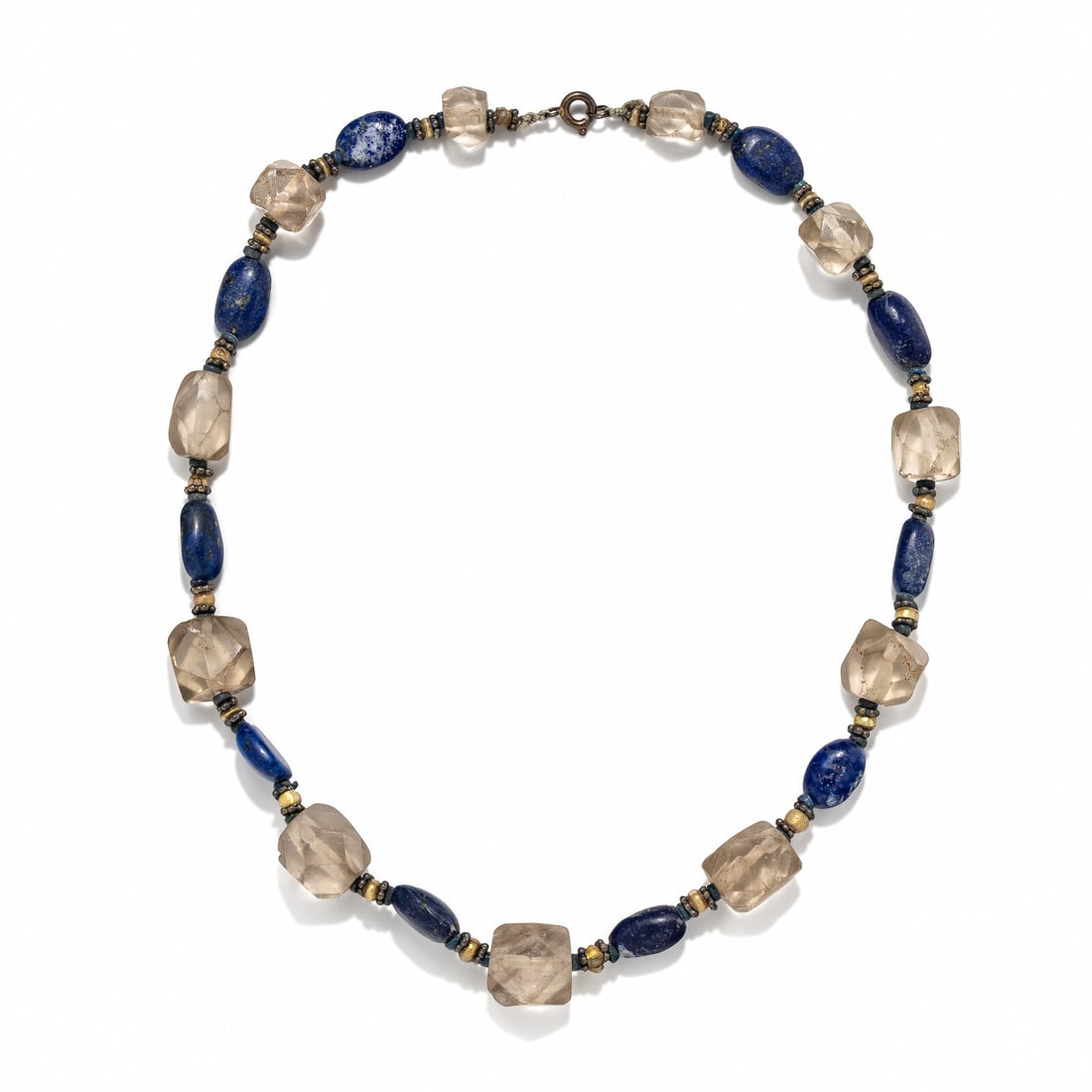 An Egyptian Lapis Lazuli and Rock Crystal Bead Necklace: An Egyptian Lapis Lazuli and Rock Crystal Bead Necklace Circa 1000 B.C. Length 46.5 cm (18 1/4 inches). Provenance: Azeez Khayat (1875-1943), New York; thence by descent. Samuel T. Freeman & Co. A