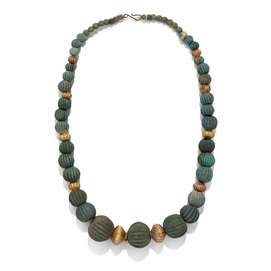 A Sumerian Gold and Melon-Shaped Bead Necklace: A Sumerian Gold and Melon-Shaped Bead Necklace Circa 2500 B.C. Length 66 cm (26 inches); High karat gold; 170.2 grams. Property from a Private Brooklyn Collection Provenance: Kay Serhal (1930-2023), N