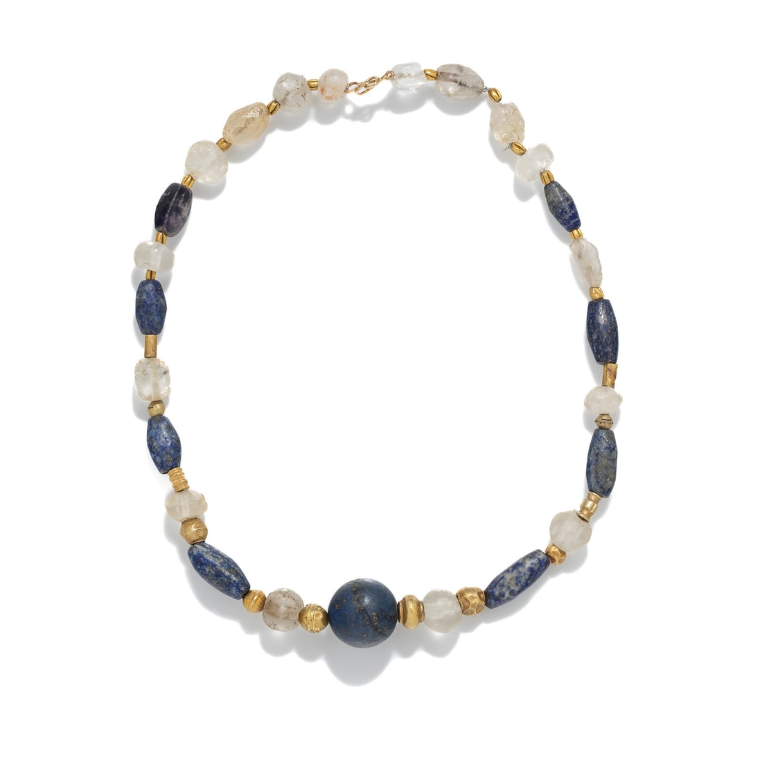 A Near Eastern Lapis Lazuli, Rock Crystal, and Gold Bead Necklace: A Near Eastern Lapis Lazuli, Rock Crystal, and Gold Bead Necklace Circa 1st Millennium B.C.-Circa 1st Century A.D. Length 43 cm (16 7/8 inches); High karat gold; 46.83 grams. Provenance: Private Colle