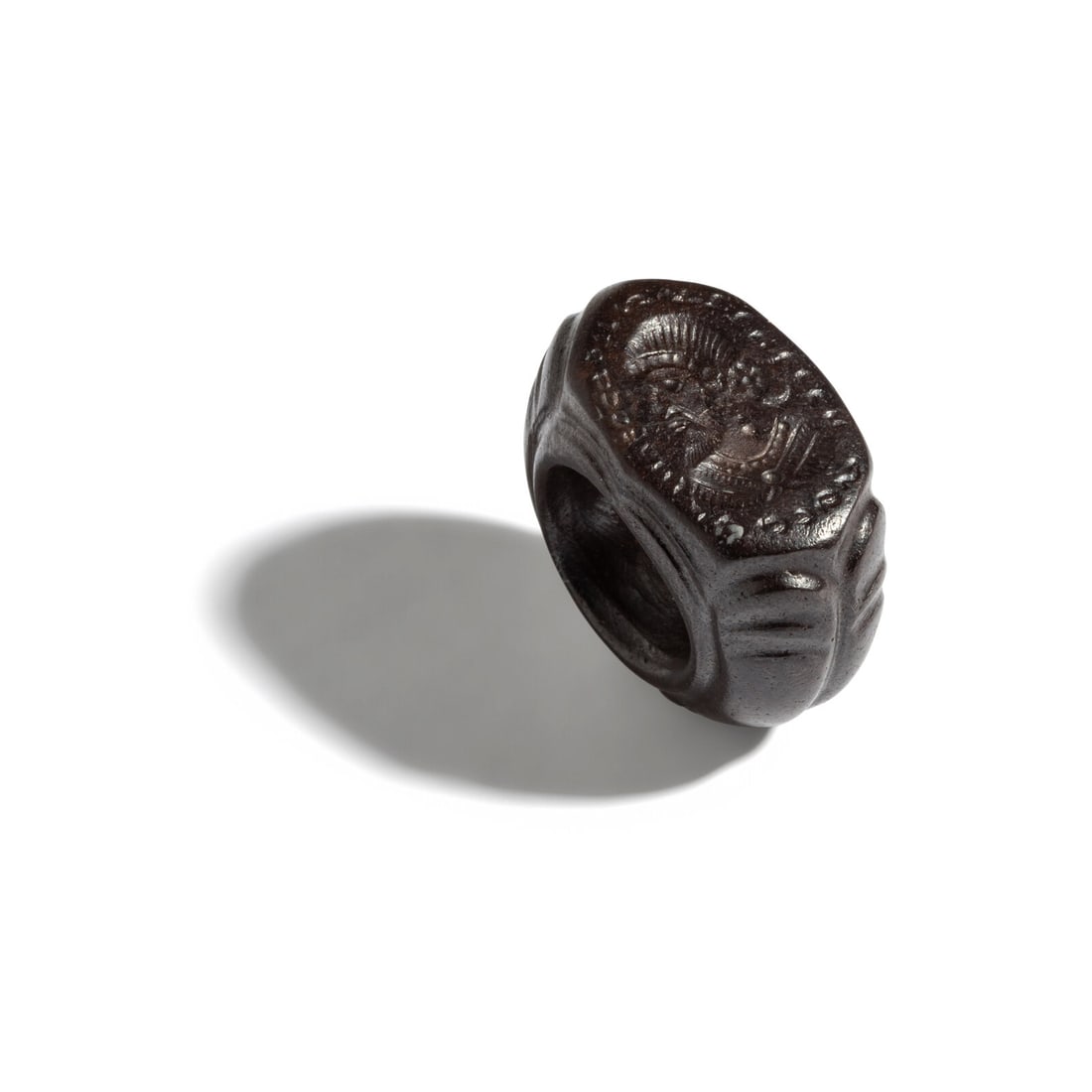 A Sasanian Hematite Ring with a Royal Portrait Bust: A Sasanian Hematite Ring with a Royal Portrait Bust Circa 5th-7th Century A.D. Width 2.7 cm (1 1/8 inches); 19.15 grams. Provenance: Private Collection, New York, 2000s.