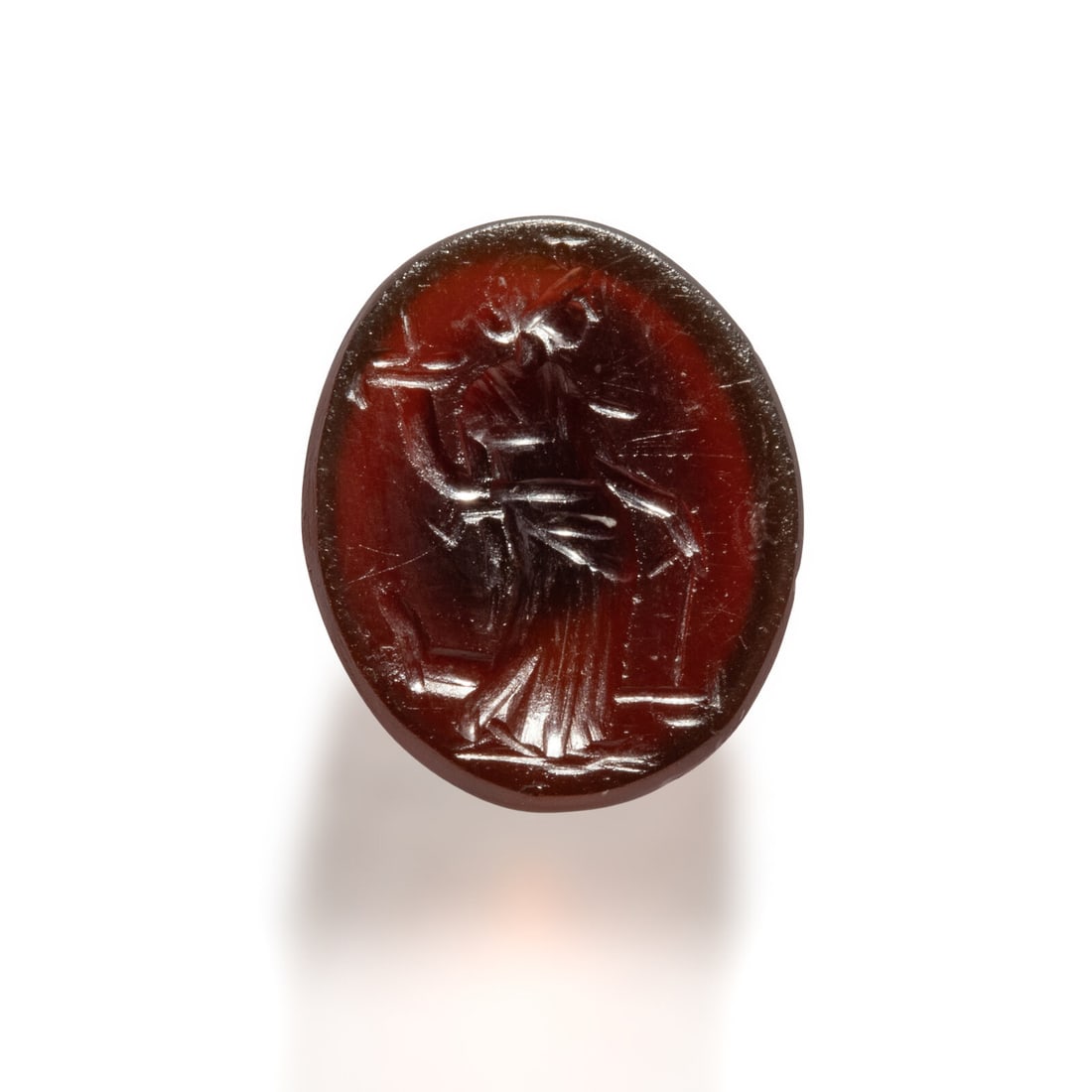 A Roman Carnelian Ring Stone with the Goddess Fortuna: A Roman Carnelian Ring Stone with the Goddess Fortuna Circa 1st-2nd Century A.D. Length 1.4 cm (1/2 inch). Provenance: Private Collection, New York, 2000s.