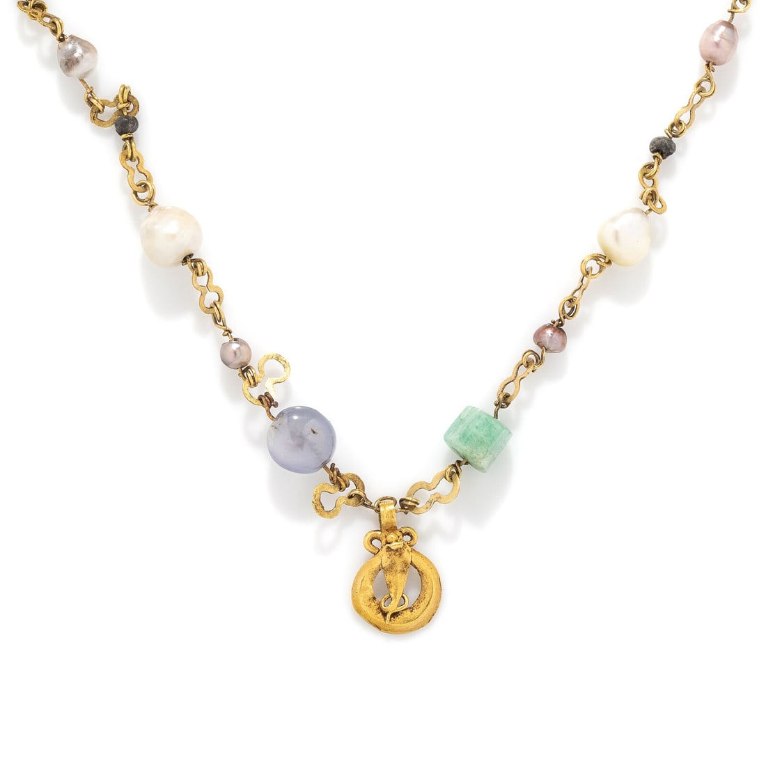 A Roman Gold, Emerald, and Lapis Lazuli Necklace with Uraeus Pendant: A Roman Gold, Emerald, and Lapis Lazuli Necklace with Uraeus Pendant Egypt, Circa 1st-2nd Century A.D. Length 43.5 cm (17 1/8 inches); High karat gold; 10 grams. The gold uraeus pendant is suspended