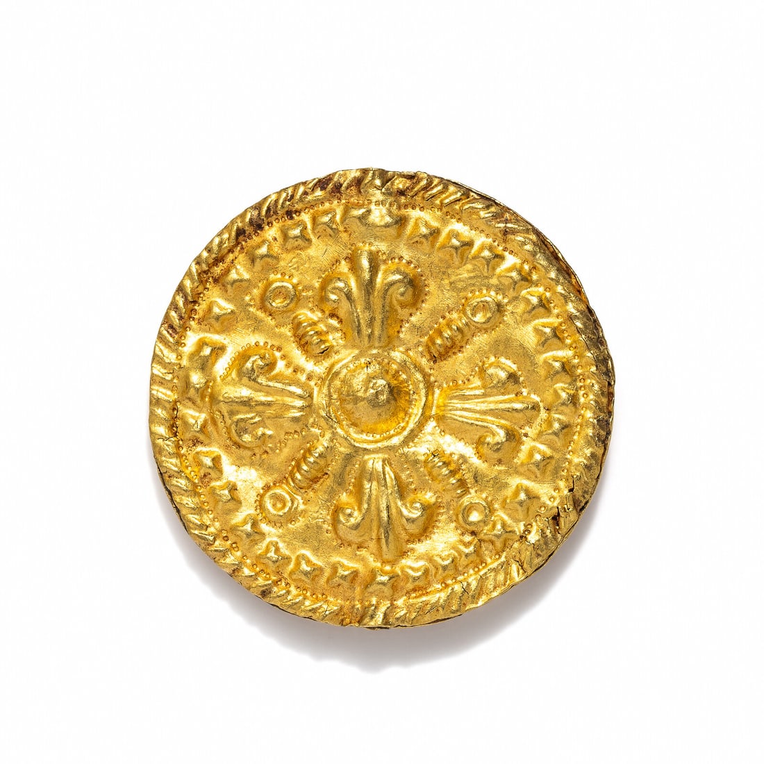 A Hellenistic Gold Double-Sided Rosette: A Hellenistic Gold Double-Sided Rosette Circa 2nd-1st Century B.C. Diameter 4.1 cm (1 5/8 inches); High karat gold; 9.31 grams. Provenance: Private Collection, New York, 2000s.