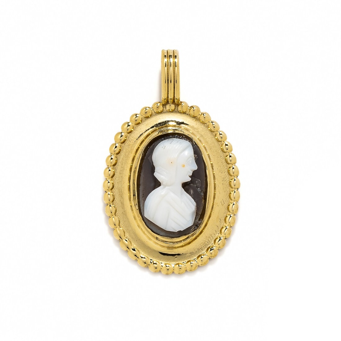 A Roman Onyx Cameo with a Female Portrait Head: A Roman Onyx Cameo with a Female Portrait Head Set in a gold pendant Circa 2nd Century A.D. Height of pendant 3.6 cm (1 3/8 inches); High karat gold; 8.2 grams. Provenance: Private Collection, New Yor