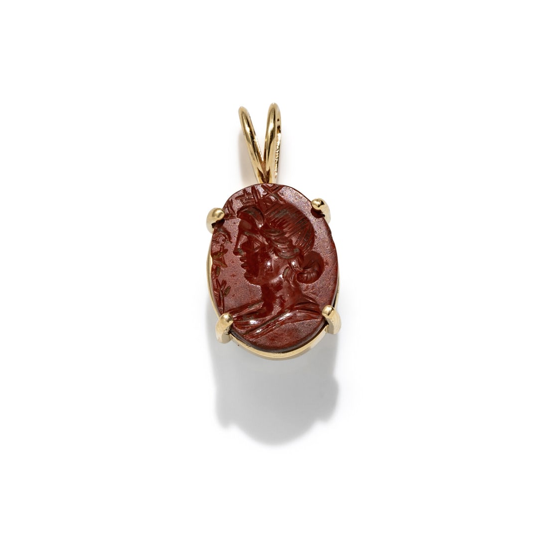 A Roman Red Jasper Ring Stone with a Female Portrait Head and Inscription: A Roman Red Jasper Ring Stone with a Female Portrait Head and Inscription Set in a gold pendant Circa 1st-3nd Century A.D. Height of pendant 2.3 cm (7/8 inch); 14 karat gold; 2.08 grams. Provenance: L