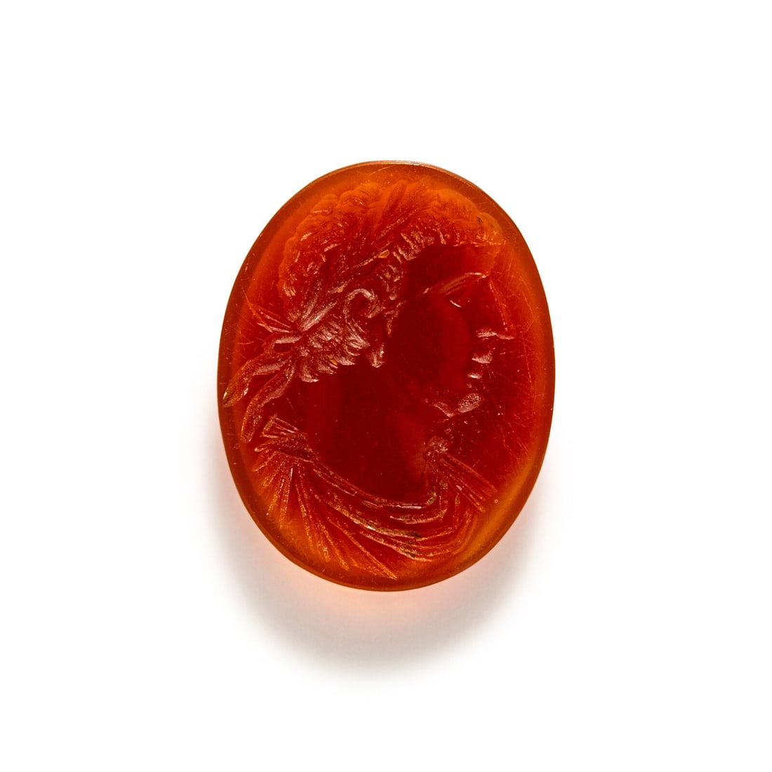 A Roman Carnelian Intaglio with the Portrait Head of an Emperor: A Roman Carnelian Intaglio with the Portrait Head of an Emperor Circa 1st Century A.D. Length 1.8 cm (3/4 inch). Provenance: Private Collection, New York, 2000s.