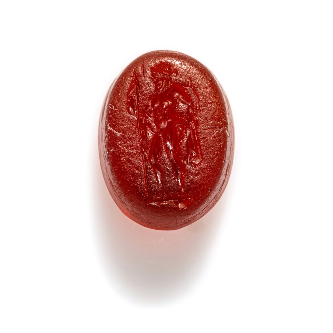 A Roman Carnelian Ring Stone with the God Poseidon: A Roman Carnelian Ring Stone with the God Poseidon Circa 1st Century A.D. Length 1.1 cm (3/8 inch). Provenance: Private Collection, New York, 2000s.