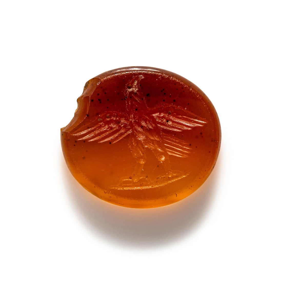 A Roman Carnelian Ring Stone with an Eagle: A Roman Carnelian Ring Stone with an Eagle Circa 3rd Century A.D. Length 1 cm (3/8 inch). Provenance: Private Collection, New York, 2000s.