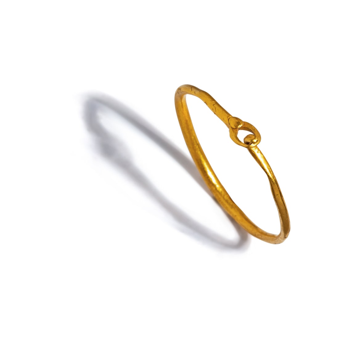 A Roman Gold Hoop and Hook Earring: A Roman Gold Hoop and Hook Earring Circa 1st-2nd Century A.D. Width 5.4 cm (2 1/8 inches); High karat gold; 23.50 grams. Provenance: Fortuna Fine Arts, New York, 1990 (A Golden Past: Jewelry from the