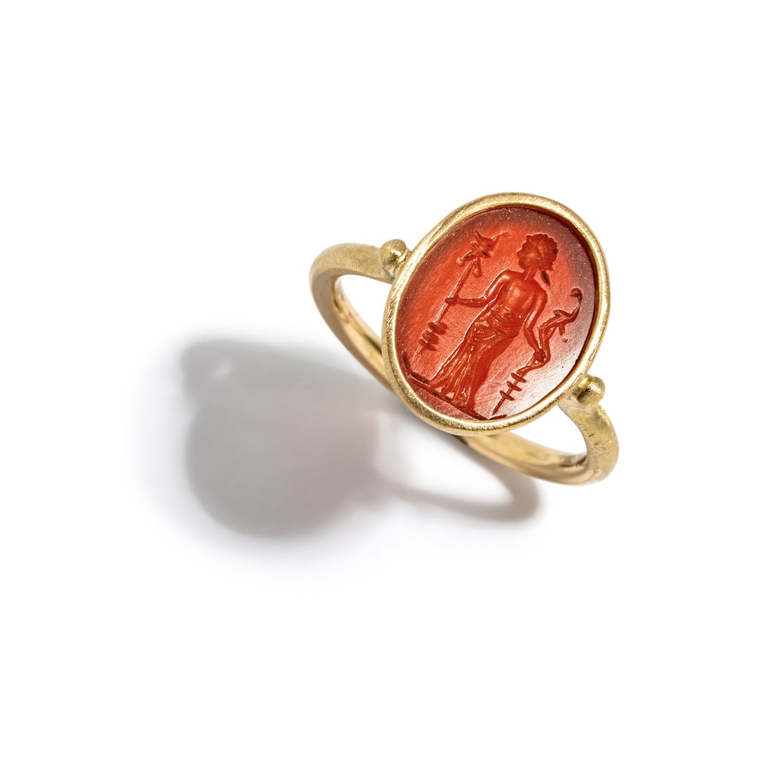 A Roman Carnelian Ring Stone with a Female Deity: A Roman Carnelian Ring Stone with a Female Deity Set in a gold ring Circa 3rd Century A.D. Height 2.3 cm (7/8 inch); Ring size 8; 14 karat gold; 3.68 grams. Provenance: Lee Kieffer Collection,