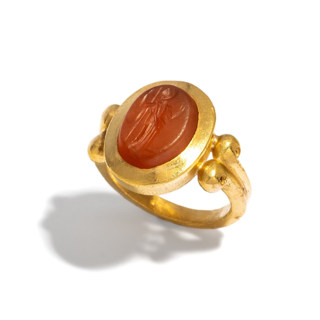 A Roman Carnelian Ring Stone with Minerva: A Roman Carnelian Ring Stone with Minerva Set in a gold ring Circa 2nd-3rd Century A.D. Height 2.1 cm (7/8 inch); Ring Size 4 1/2; High karat gold; 10.29 grams. Provenance: Private Collection,